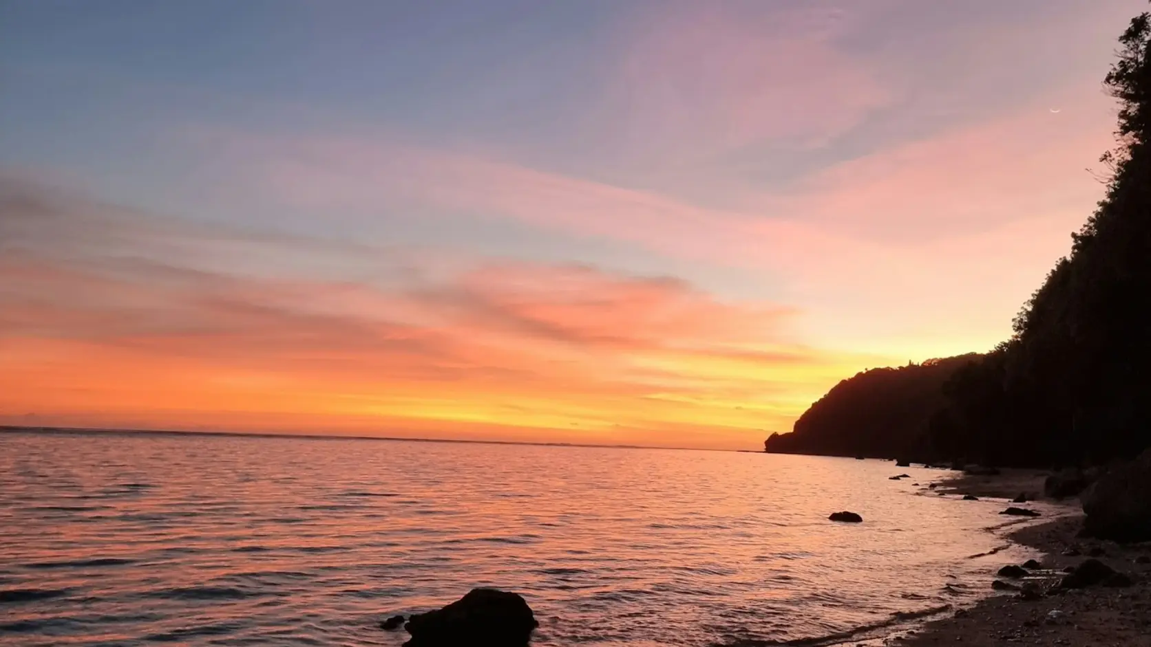 Real coastal sunset in Nusa Dua, Bali